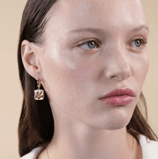 Lily earrings on mother-of-pearl plate