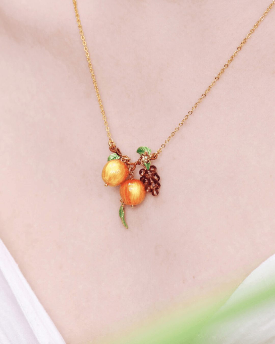 Crisp apples and bunches of grapes pendant necklace